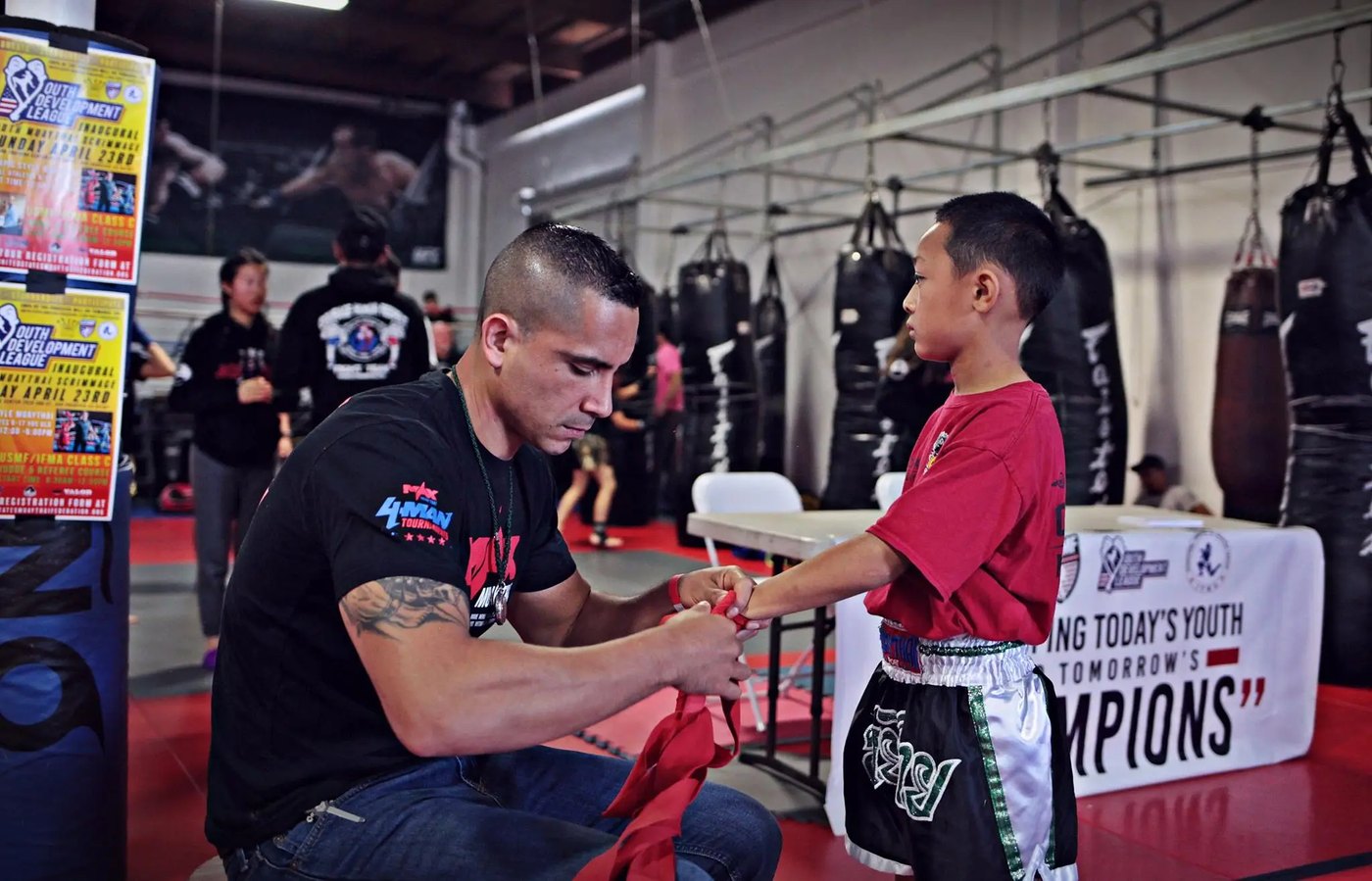 Coach wrapping a student's hands